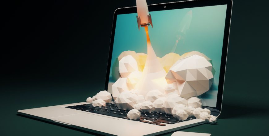 Startup,Concept,With,Rocket,Flying,Out,Of,Laptop,Screen,On